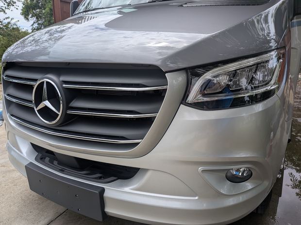 Clean front cap and grille of a Mercedes Sprinter motorhome